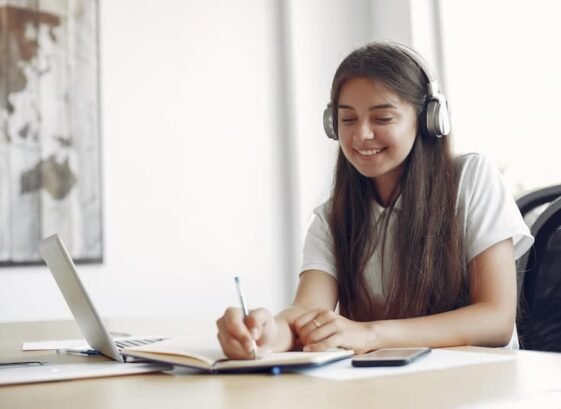 young-student-sitting-table-use-laptop (1)