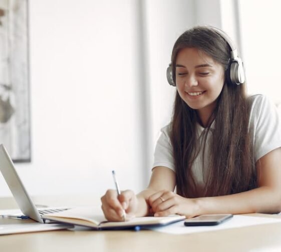 young-student-sitting-table-use-laptop (1)