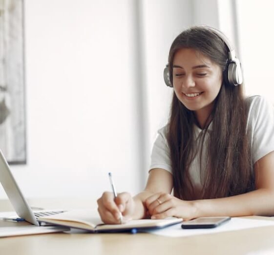 young-student-sitting-table-use-laptop (1)